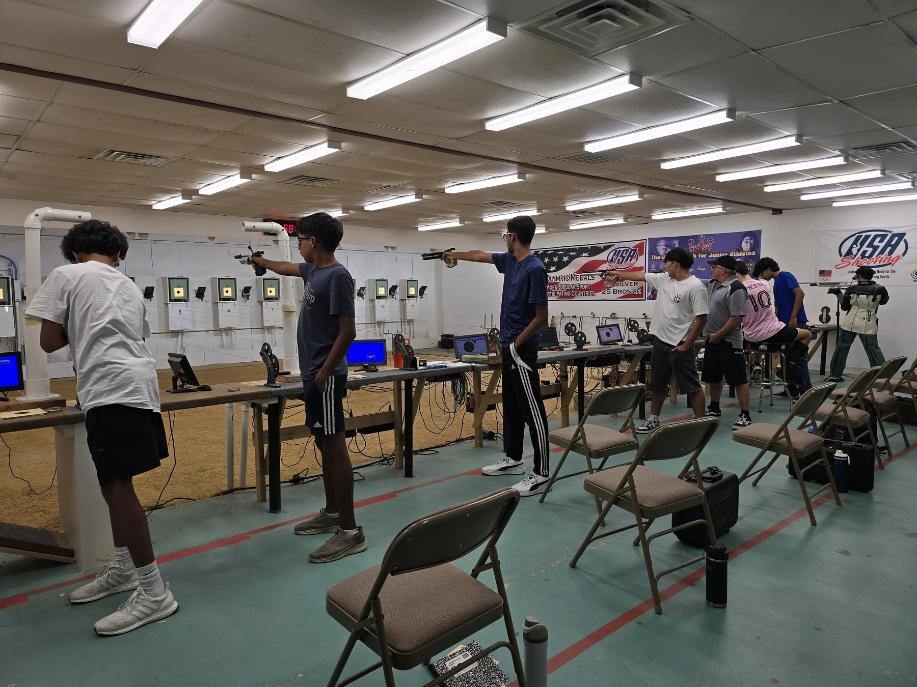 Athletes training on the Team Shooting Stars 10-meter electronic-target range
